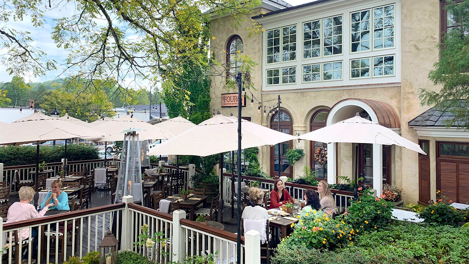 Guests dining in the outdoor space at Madison’s Restaurant & Wine Garden